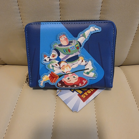 Loungefly PIXAR MOMENTS TOY STORY JESSIE & BUZZ ZIP AROUND WALLET - Picture 2 of 3